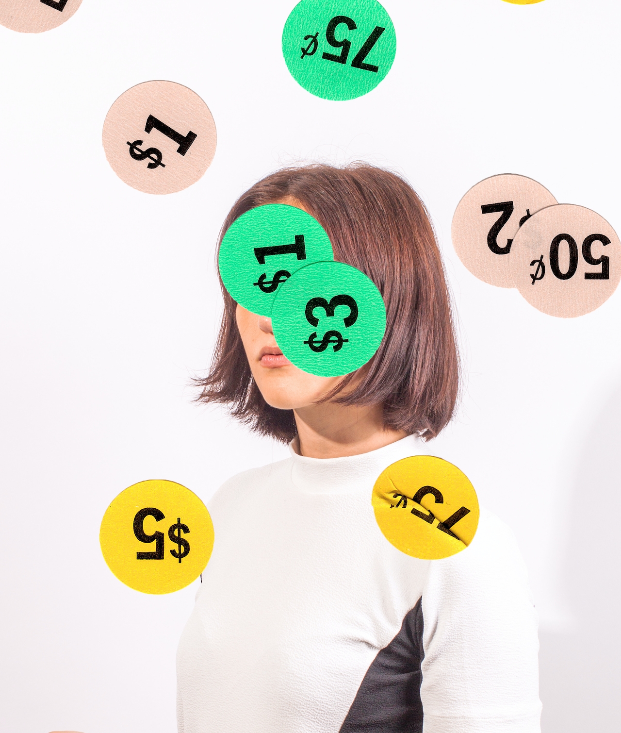 A photo of a brunette girl with price tag stickers covering her face. Used as the featured image in a blog post about how to market your business without using social media.
